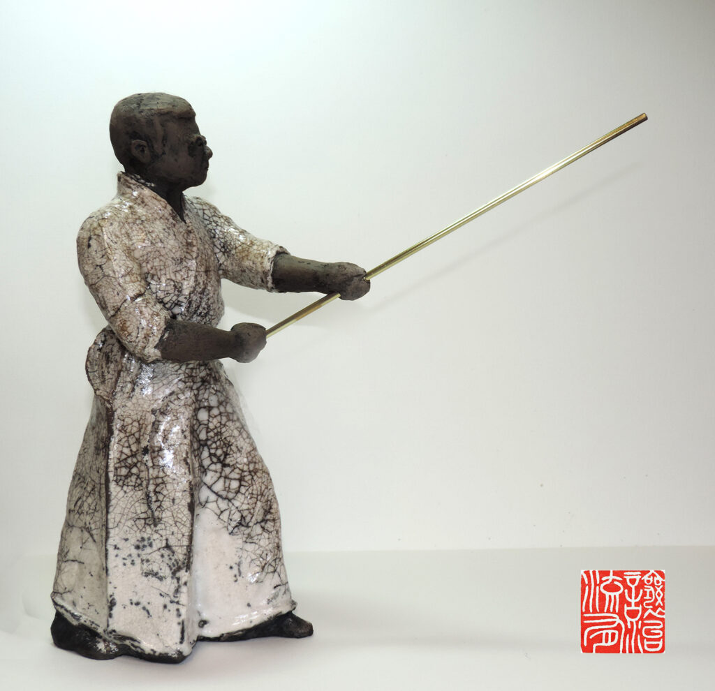 Détail d'une pièce en Raku Iaido montrant le mouvement du sabre, par Georges Roux